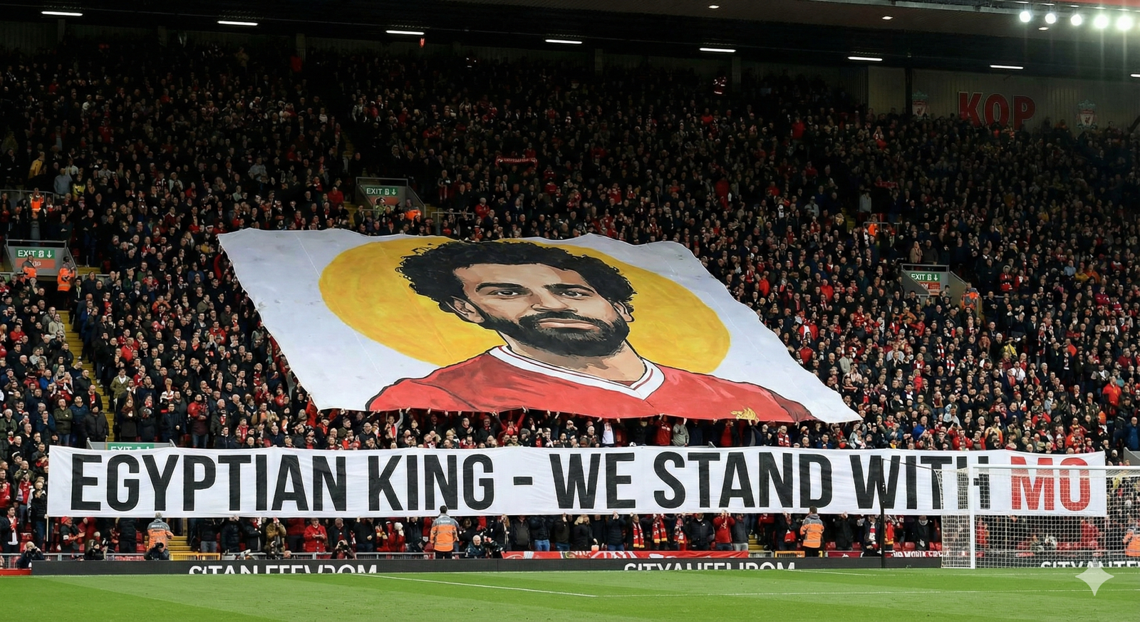 A massive banner in the Anfield Kop end showing Mohamed Salah with the text EGYPTIAN KING - WE STAND WITH MO