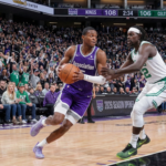 De'Aaron Fox driving the basket against the Boston Celtics in the 2026 season opener.