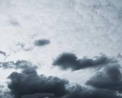 Minneapolis city skyline under overcast skies.